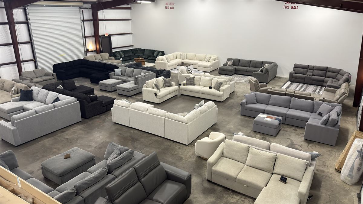 The Couch Kings showroom floor at 1820 Cowen Rd, with dozens of sectionals on display
